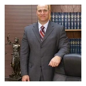 The Sexton Law Firm logo